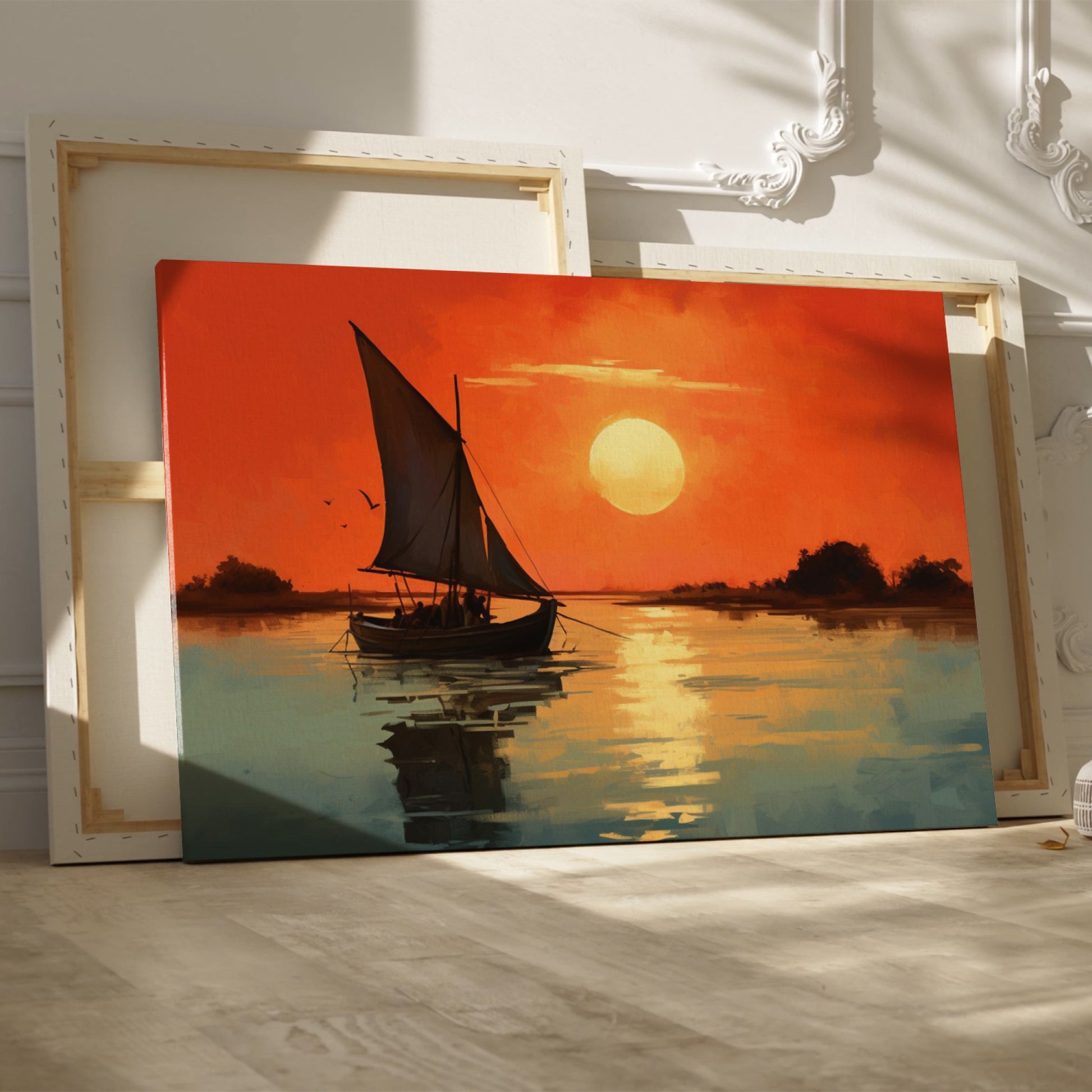 Framed canvas print of a sailboat against an orange sunset with water reflections