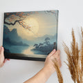 Framed canvas print of a tranquil Zen moment with a silhouette against an Oriental landscape at sunrise