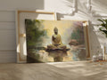 Framed canvas print of a serene golden Buddha seated by water with impressionistic background