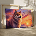 Framed canvas print of a majestic wolf against a vibrant sunset background in fiery tones