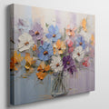 Framed canvas print of vibrant impasto painted flowers in a vase with rich textures and a colourful palette