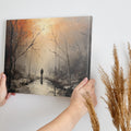 Framed canvas print of a solitary figure walking through a misty, autumnal forest with warm, glowing light