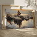 Framed canvas print of serene seascape with man sitting on rocks at sunset