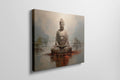 Framed canvas print of a meditative Buddha statue in warm earthy tones