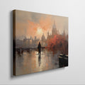 Framed canvas print of an impressionistic cityscape at sunset with reflections on a river