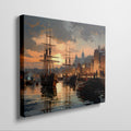 Framed canvas print of a historical port with sailing ships at sunset, featuring warm golden hues and reflective water