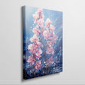 Framed canvas print of radiant pink orchids against a blue backdrop with watercolor textures