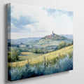 Framed canvas print of a Tuscan landscape with watercolor rolling hills and a village