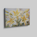 Framed canvas print of realistic sunlit yellow daylilies with lush green leaves