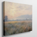 Framed canvas print of an impressionist painting with a sunrise over a tranquil countryside landscape