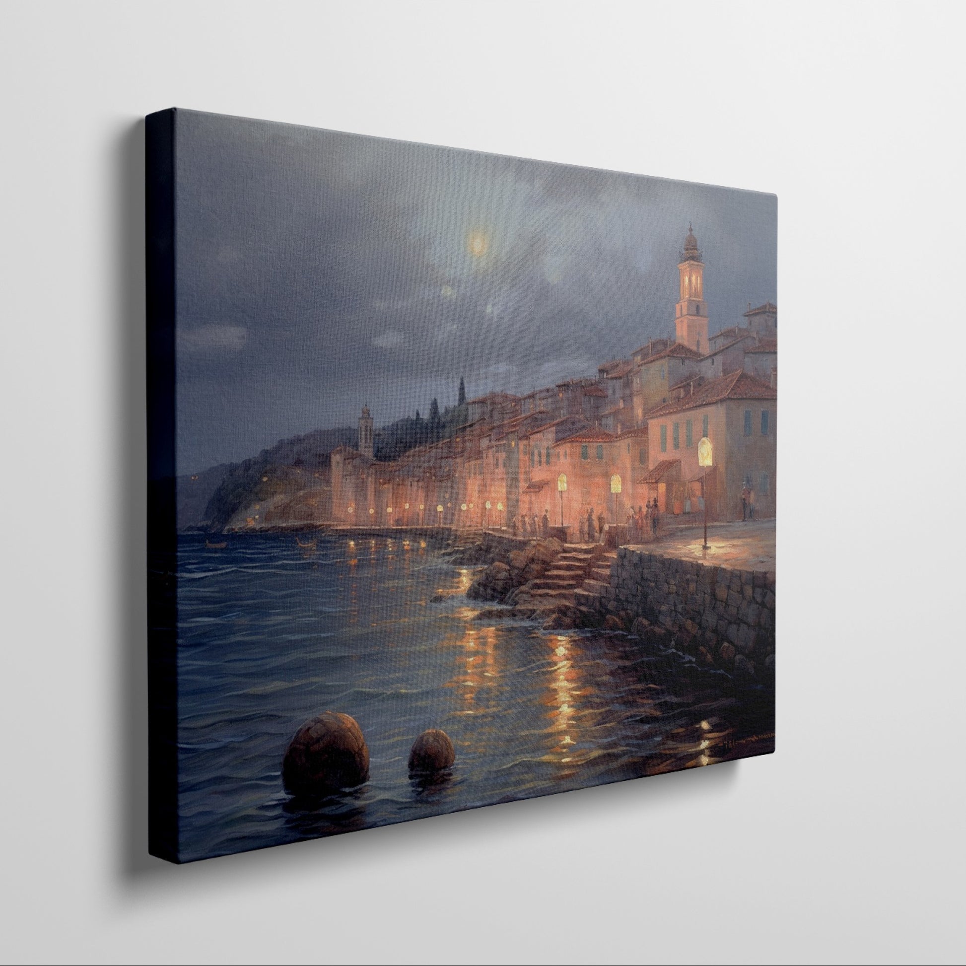 Framed canvas print of a moonlit Mediterranean coastal town with glowing street lamps