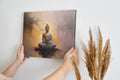 Framed canvas print of serene Buddha in meditation with abstract warm background