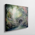 Framed canvas print of a tranquil watercolour garden with a stone bridge and flowing stream surrounded by colourful foliage