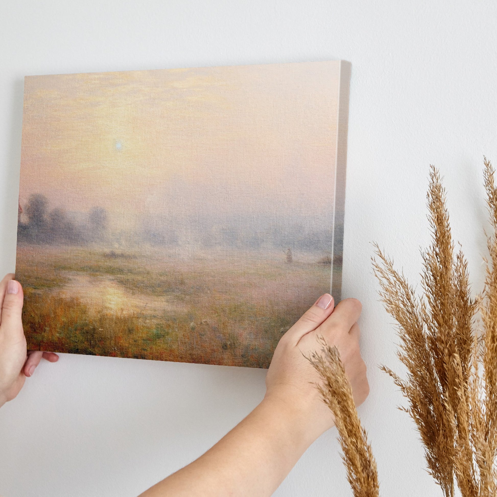 Framed canvas print of a misty countryside meadow with a sunrise and soft pastel colours