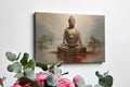 Framed canvas print of a meditative Buddha statue in warm earthy tones