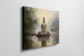 Framed canvas print of a serene golden Buddha seated by water with impressionistic background