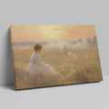 Framed canvas print of a woman in a white dress gazing at a misty sunrise over a golden field