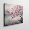 Framed canvas print of a serene cherry blossom tree by a tranquil lake with soft pastels and misty ambience