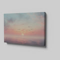 Framed canvas print of a tranquil seascape at sunset with birds and pastel skies