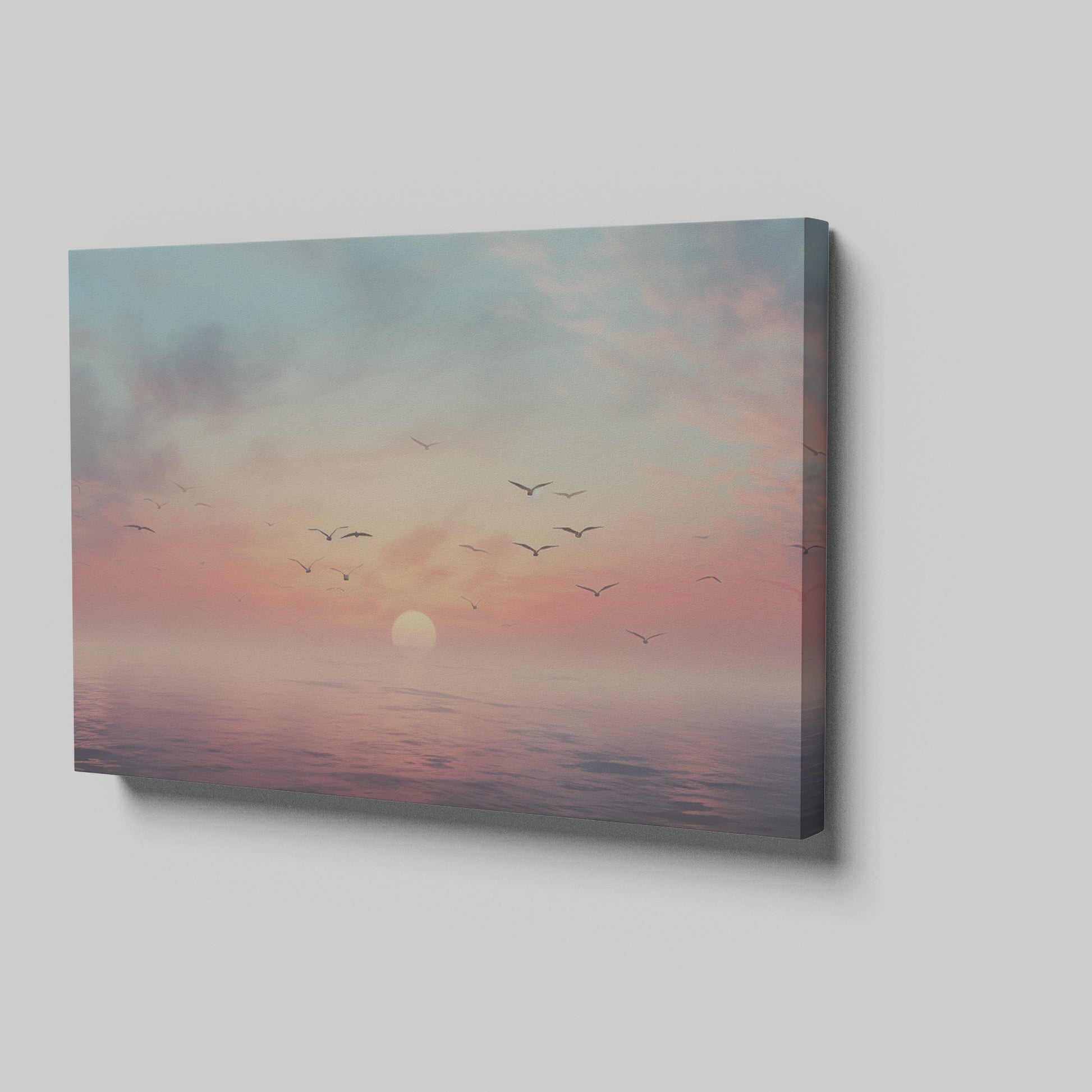 Framed canvas print of a tranquil seascape at sunset with birds and pastel skies