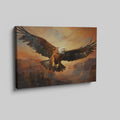 Framed canvas print of a majestic eagle flying over a canyon at sunset with warm golden and orange tones