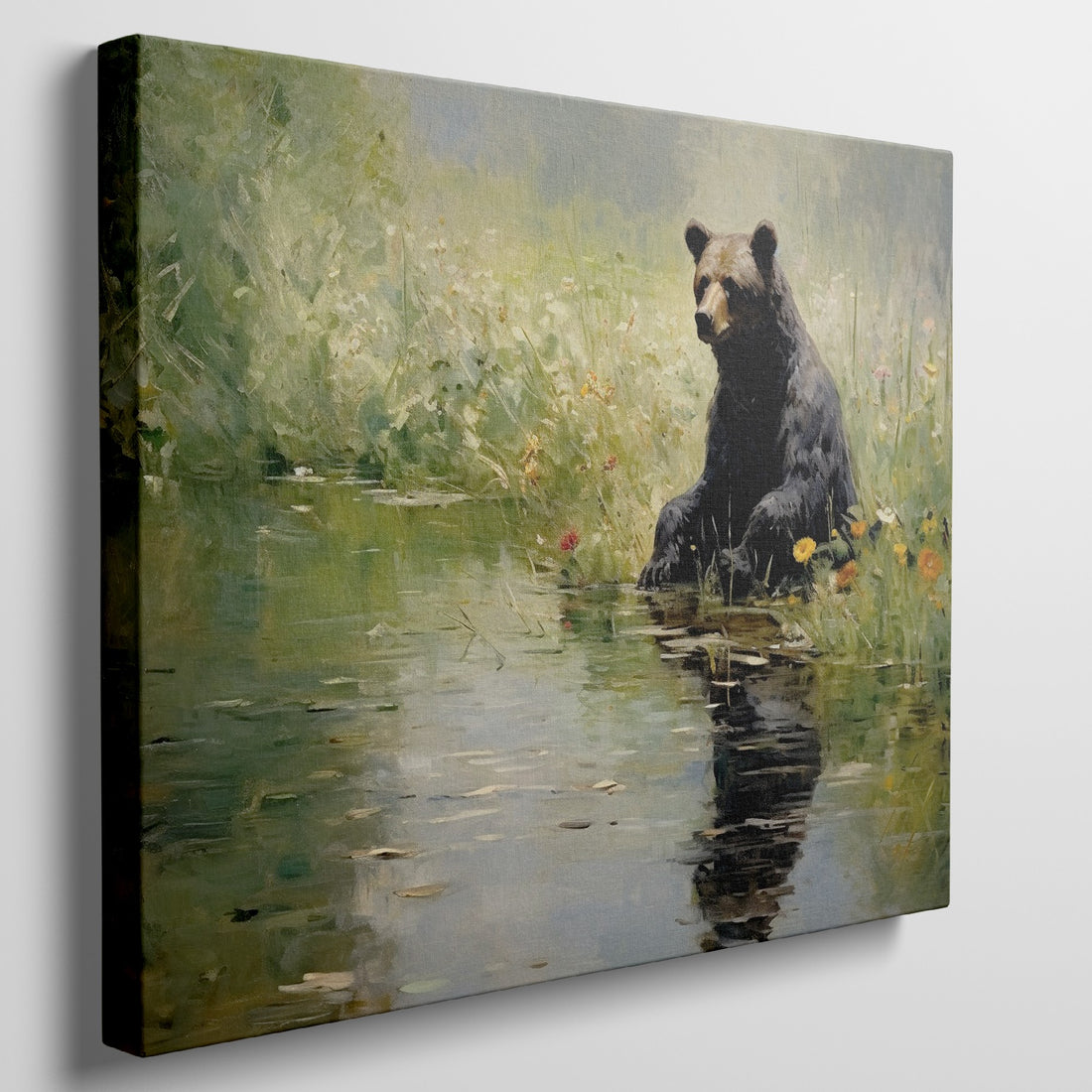 Framed canvas print of a bear sitting by a pond with floral surroundings