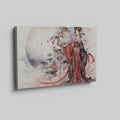 Framed canvas print of an Elegant Geisha in traditional Japanese attire with a sakura blossom and moon backdrop