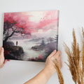 Framed canvas print of an oriental landscape with cherry blossoms, pagodas, and a silhouette of a person