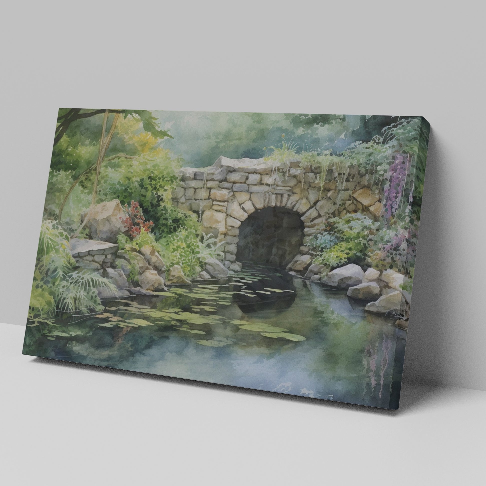 Framed canvas print of a serene watercolor painting of a rustic stone bridge over a calm pond with water lilies