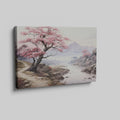 Framed canvas print of a serene cherry blossom landscape with mountains and a river