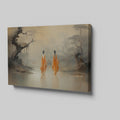 Framed canvas print of monastic figures in saffron robes by a misty river amidst autumn trees