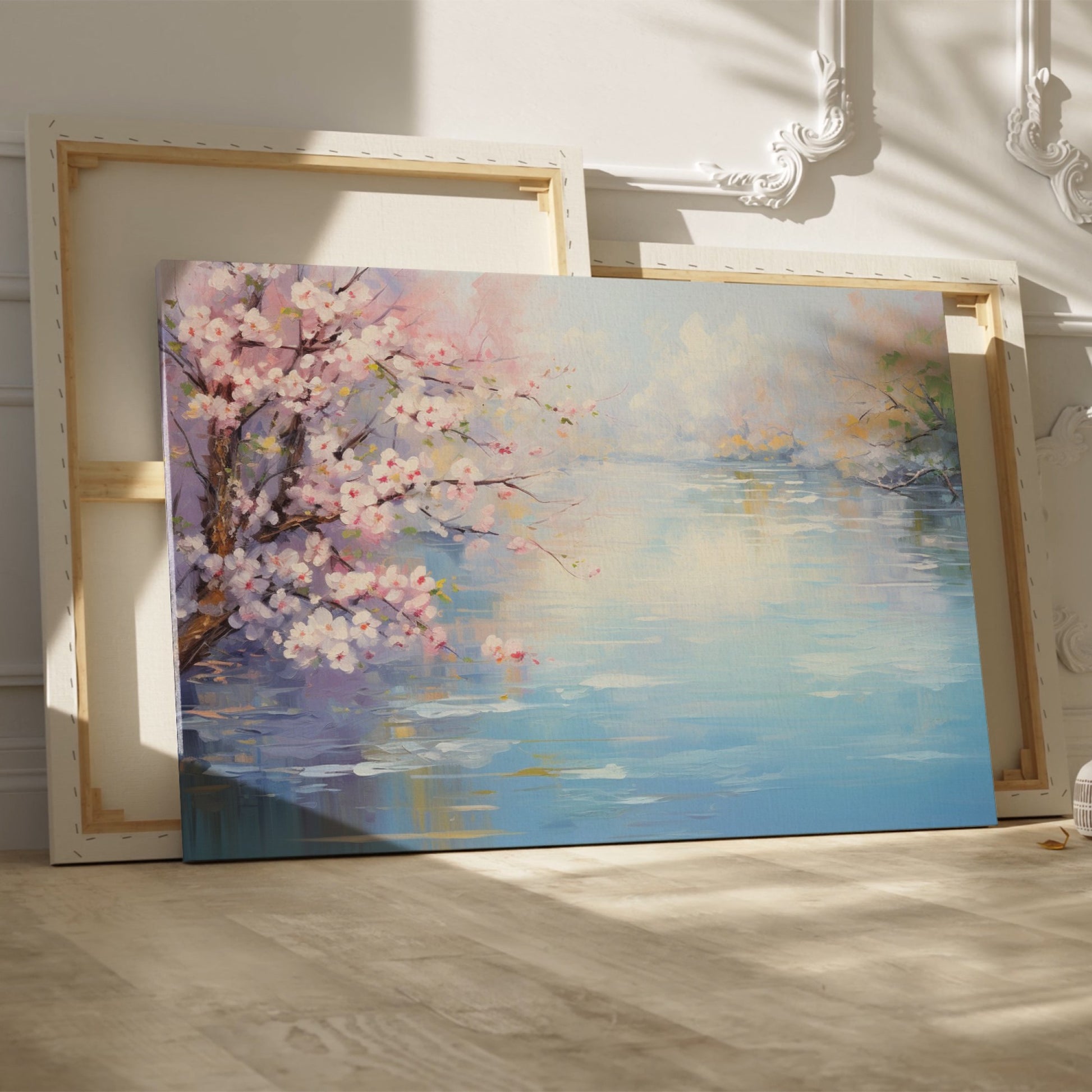 Framed canvas print of a serene impressionist painting with cherry blossoms and river reflections