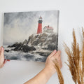 Red lighthouse on stormy cliff with ocean waves and birds, in a painted style