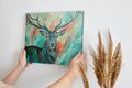 Framed canvas print of a colourful impressionistic painting of a stag with abstract elements