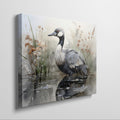 Framed canvas print of a crane amongst reeds in a watercolor wetland scene with neutral tones