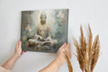 Framed canvas print of a serene Buddha in meditation with ethereal blue and earthy tones