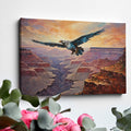 Framed canvas print of a majestic eagle flying over a dramatic canyon landscape at sunset