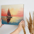 Impressionistic sailboat at sunset with vibrant orange, red, and blue hues reflecting on water