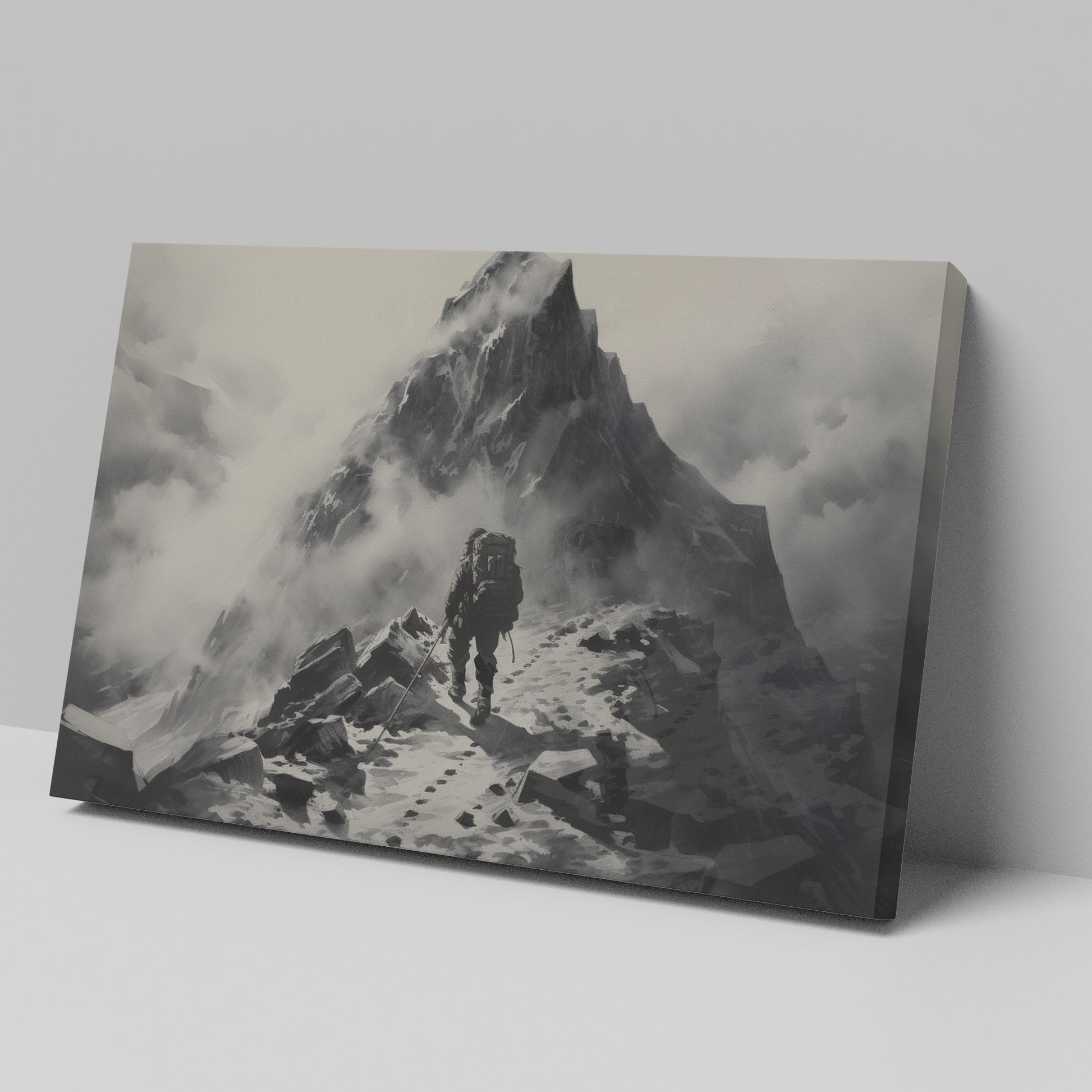 Framed canvas print of a lone mountaineer making their way up a foggy, monochromatic mountain scene