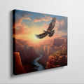 Framed canvas print of a majestic eagle flying over a sunset-lit river canyon