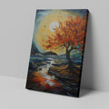 Framed canvas print of an autumnal tree with orange and red leaves against a sunset over a blue seascape