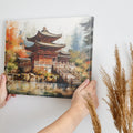 Framed canvas print of a Japanese temple amid autumn scenery with vibrant red and orange leaves