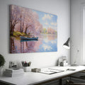 Framed canvas print of a serene river scene with cherry blossoms and a small boat