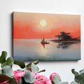 Framed canvas print of a sailboat on calm waters with sunrise and warm hues