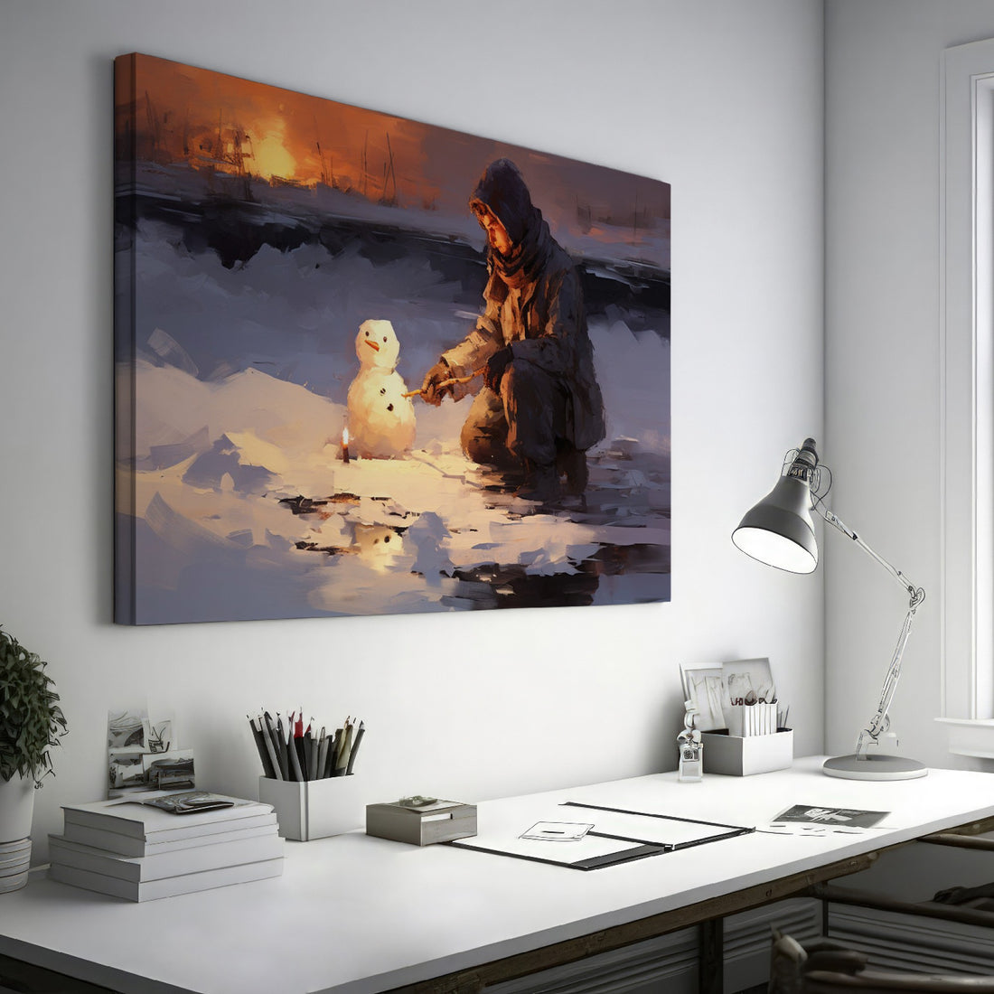 Framed canvas print of a person building a snowman at sunset with a winter landscape