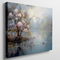 Framed canvas print of impressionist painting with blossoming trees by a serene lake