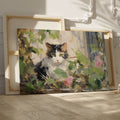 Framed canvas print of impressionist painting featuring a cat with roses and green leaves