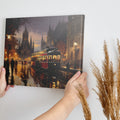 Framed canvas print of a vintage tram travelling through a city with majestic cathedral and warm evening lights reflected on wet streets