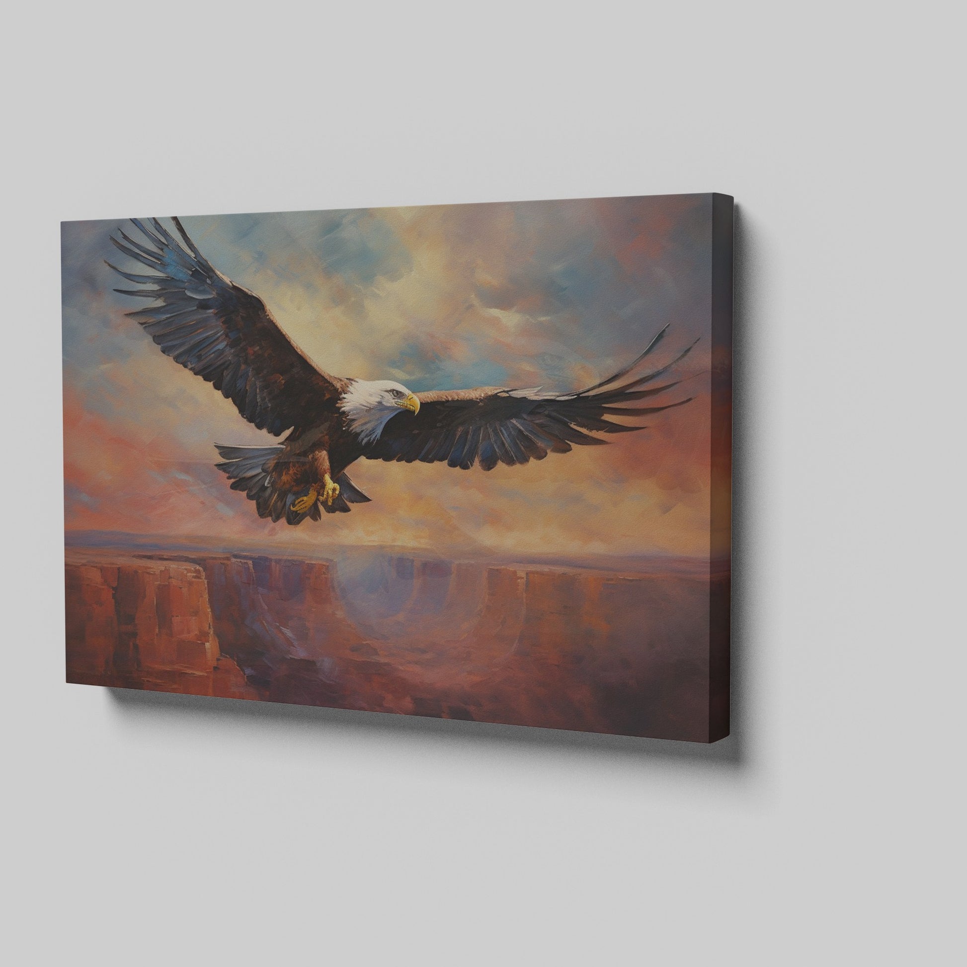 Framed canvas print of a majestic eagle in flight over a canyon at sunset with warm shades of orange and blue