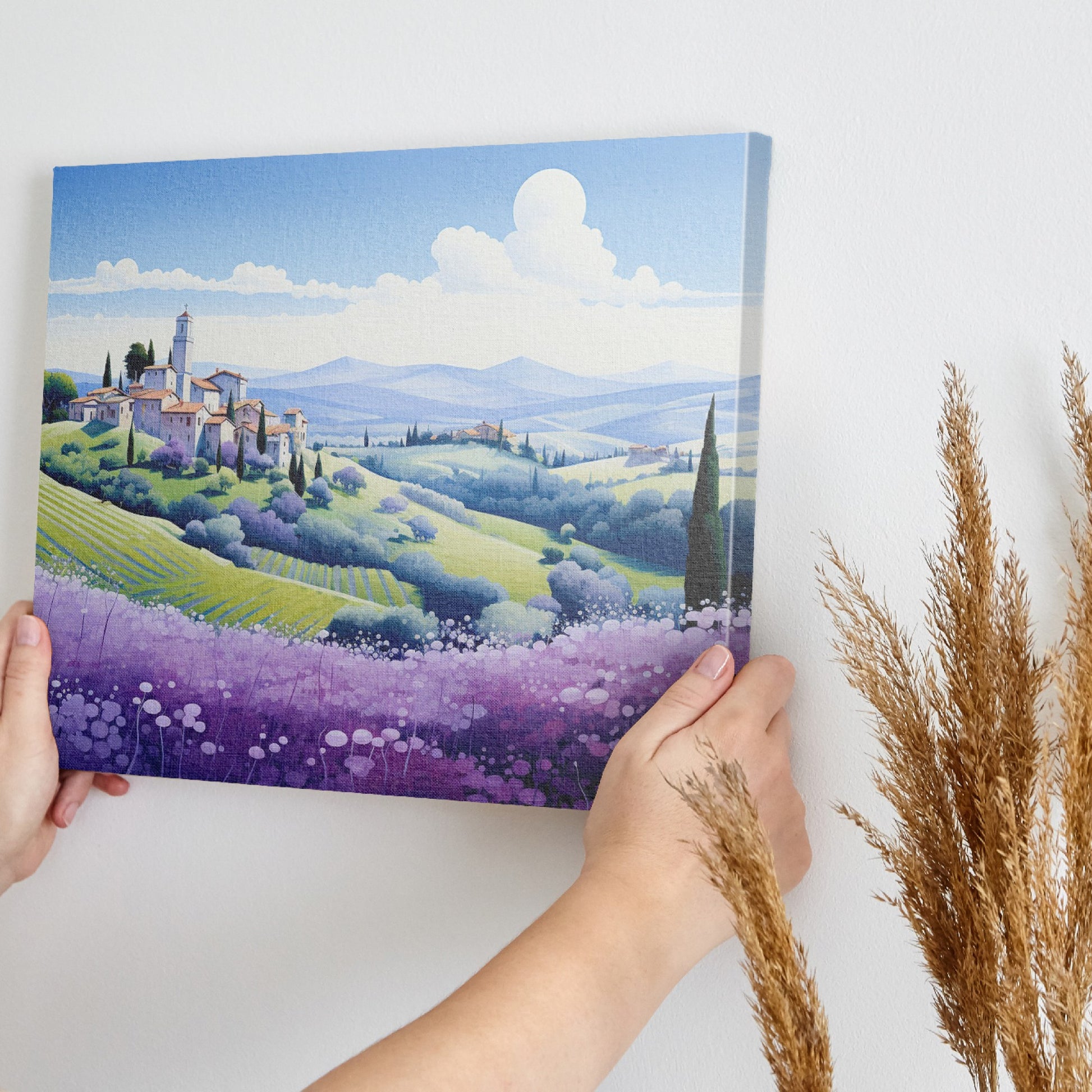 Framed canvas print of stylised Tuscan village landscape with pastel countryside and purple floral field